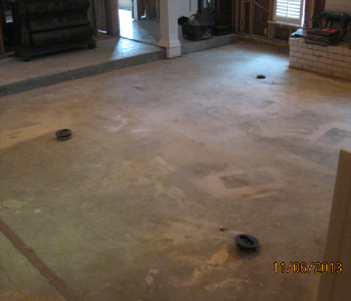 Sunken living room after drying and flooring removal showing floor mounted 