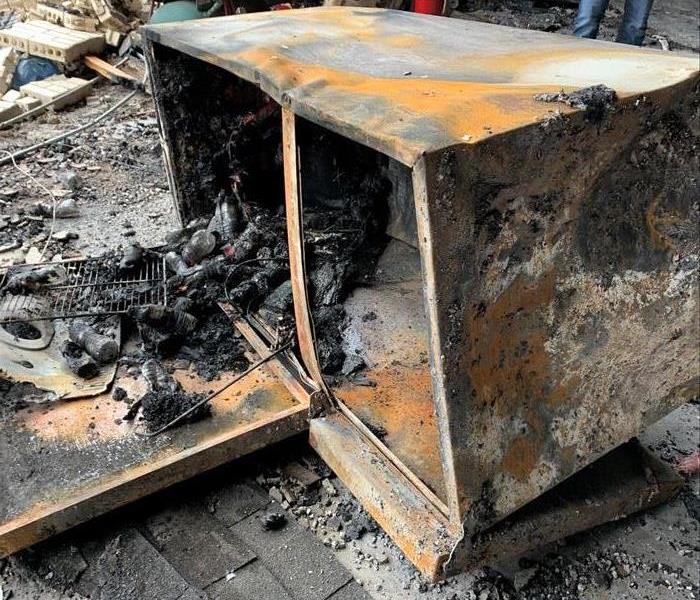 Almost unrecognizable burned up refrigerator