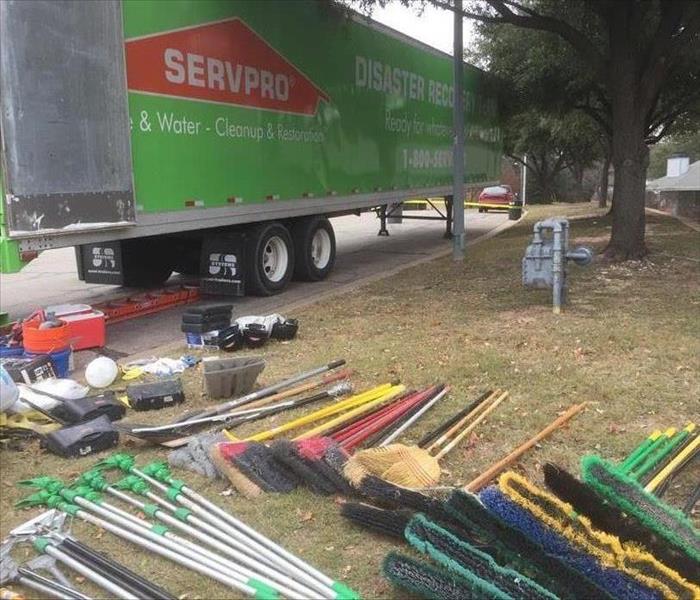 55' semi trailer with numerous shovels and other hand tools staged neatly in the grass during opening of the trailer